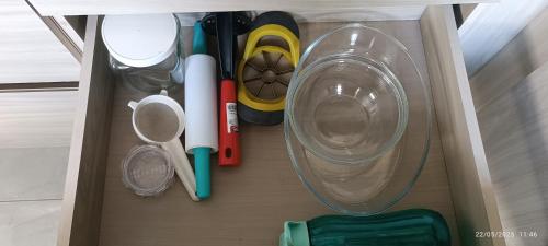 a drawer with pens and other office items in it at Sobrado Completo Belíssima in Pelotas