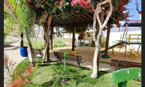 a park with benches and trees and a playground at Condomínio São Francisco in Petrolina