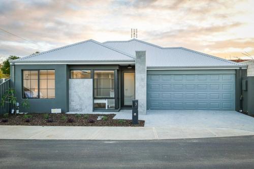 a house with a garage at Stables Lane Retreat in Busselton