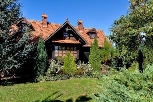 a house with a red roof and some trees at Apartments with parking space Marusevec, Zagorje - 23936 in Maruševec
