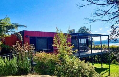 a house with a view of the ocean at Hillstop Mallacoota in Mallacoota
