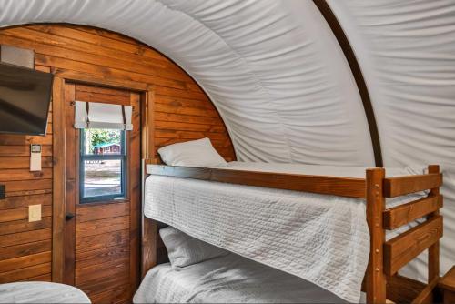 a bedroom with a bed in a tent at Cover wagon PA Grand Canyon in Gaines