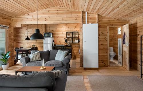 a living room with two couches and a kitchen at Awesome Home In Gedser With Wifi in Gedser
