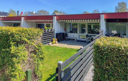 a house with a fence in front of it at Stunning Home In Haderslev With Wifi in Haderslev