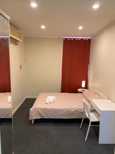 Postel nebo postele na pokoji v ubytování Chadstone Holiday W1 Villa