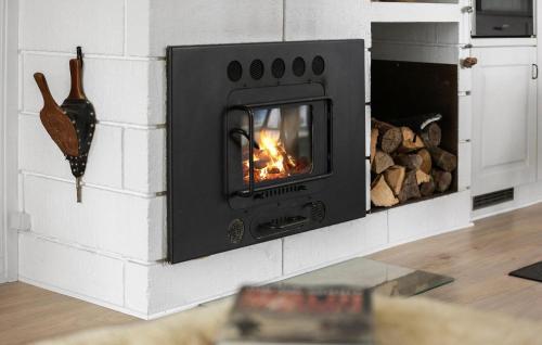 a brick oven with a fire in it at Awesome Home In Sydals With Wifi in Klinting