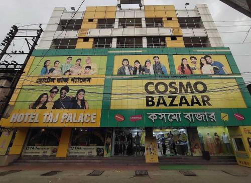 a building with a large advertisement on the side of it at Hotel O Taj Palace in Tarapith