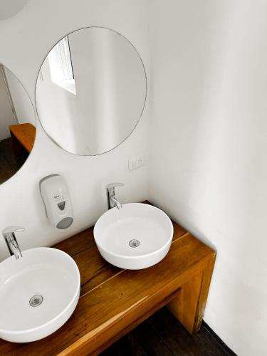a bathroom with two sinks and a mirror at Club Cenotes Tulum in Balcheil