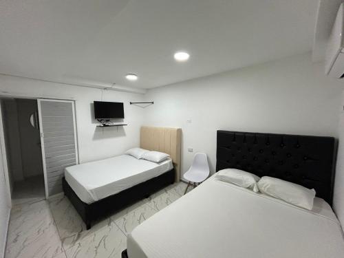 Postel nebo postele na pokoji v ubytování Lago Hotel