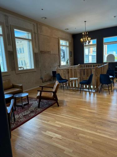 a large room with chairs and a waiting room at Unicorn Zebra in Tucson