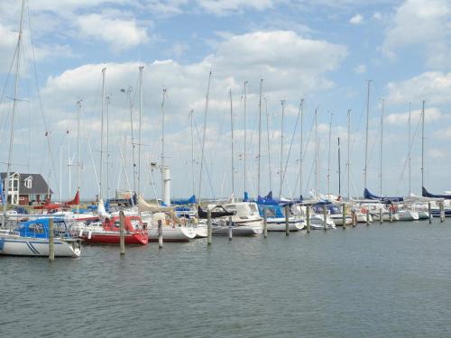 a bunch of boats are docked in the water at 4 person holiday home on a holiday park in Lemvig