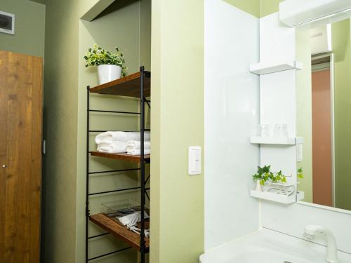 Koupelna v ubytování HOTEL StayLuck KOTOHIRA