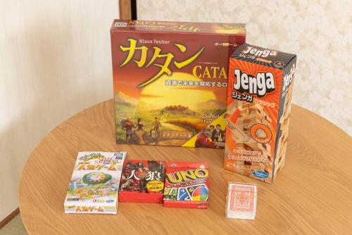 three boxes of games on a wooden table at Hakone-Yumoto Domino Hakone HY13 in Hakone