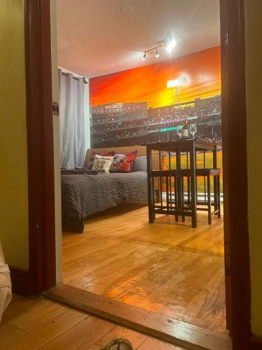 a living room with a table and a couch at Downtown Boston Common Studio Theater District Chinatown Smart HDTV TD Garden Bruins Celtics Patriots in Boston