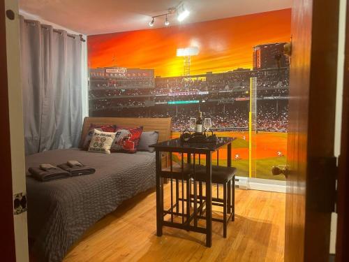 a bedroom with a bed and a view of a baseball game at Downtown Boston Common Studio Theater District Chinatown Smart HDTV TD Garden Bruins Celtics Patriots in Boston