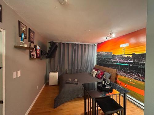a living room with a baseball mural on the wall at Downtown Boston Common Studio Theater District Chinatown Smart HDTV TD Garden Bruins Celtics Patriots in Boston