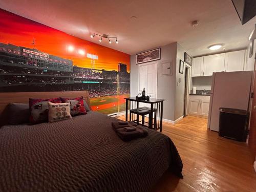 a bedroom with a bed with a baseball mural on the wall at Downtown Boston Common Studio Theater District Chinatown Smart HDTV TD Garden Bruins Celtics Patriots in Boston