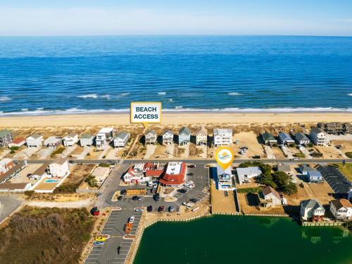 an aerial view of a resort on the beach at 5062 - Our Bright Idea in Kill Devil Hills
