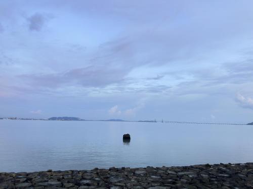 a body of water with a object in the water at Amazing Seaview Duplex George Town Maritime Suites 20 in George Town