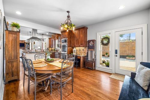 a kitchen and dining room with a table and chairs at The Buford Manor in Buford