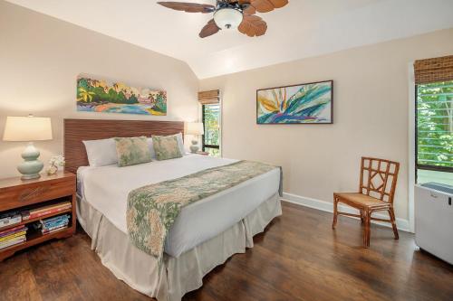 a bedroom with a bed and a ceiling fan at Lae Nani 123 in Wailua