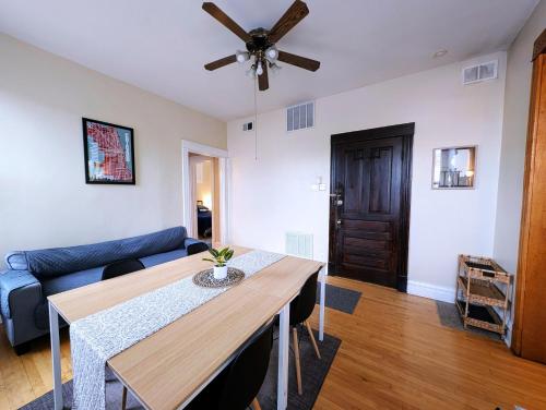 a living room with a table and a couch at The Roscoe Village Guesthouse in Chicago
