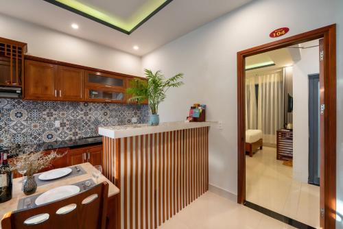a bathroom with a sink and a mirror at Sunset Beach Hoi An in Tân Thành (1)