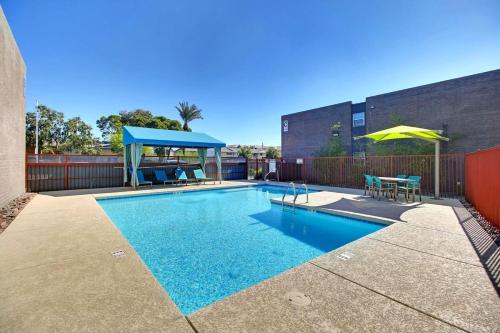a swimming pool with a gazebo next to a building at 2 Bed 1 Bath Quiet Apartment Central Location in Phoenix in Phoenix