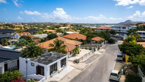 an aerial view of a residential street with houses at Apartment Lovely Rose with garden Jacuzzi in Jan Thiel
