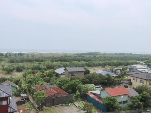 an aerial view of a small village with houses at Hotel New Otsuka in Shirako
