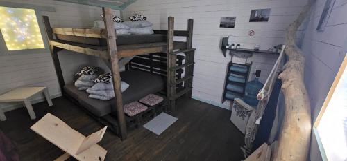 an overhead view of a room with bunk beds at Lighthouse Benki in Užava