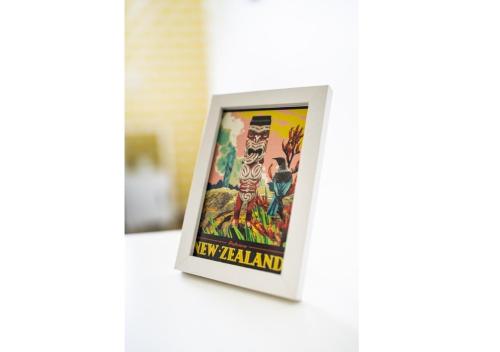 a framed picture of a new felzman sign on a wall at FOREST WATERS in Haruru