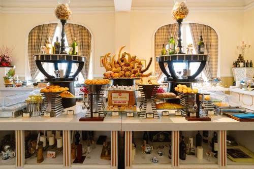 a buffet of food on display in a store at Dalat Palace Heritage Hotel in Da Lat