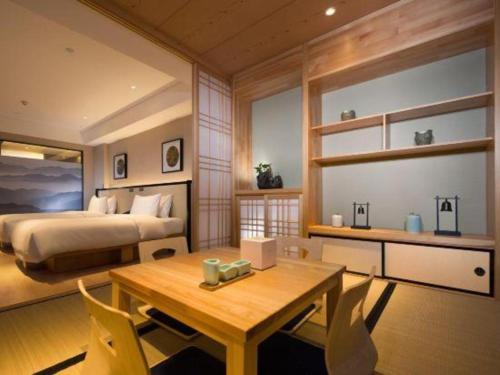 Ένα ή περισσότερα κρεβάτια σε δωμάτιο στο The Hotel V Nanjing Confucius Temple