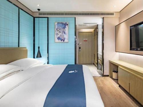 Ένα ή περισσότερα κρεβάτια σε δωμάτιο στο Echarm Hotel Guilin Railway Station the MixC