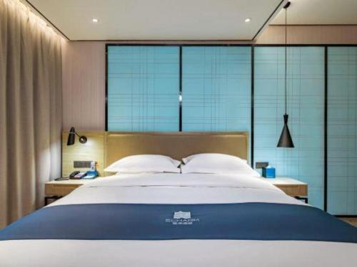 Ένα ή περισσότερα κρεβάτια σε δωμάτιο στο Echarm Hotel Guilin Railway Station the MixC