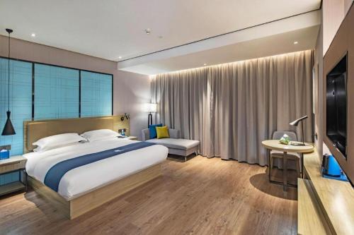 Ένα ή περισσότερα κρεβάτια σε δωμάτιο στο Echarm Hotel Guilin Railway Station the MixC