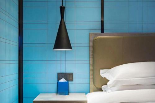 Ένα ή περισσότερα κρεβάτια σε δωμάτιο στο Echarm Hotel Guilin Railway Station the MixC