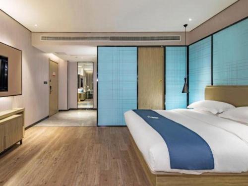 Ένα ή περισσότερα κρεβάτια σε δωμάτιο στο Echarm Hotel Guilin Railway Station the MixC