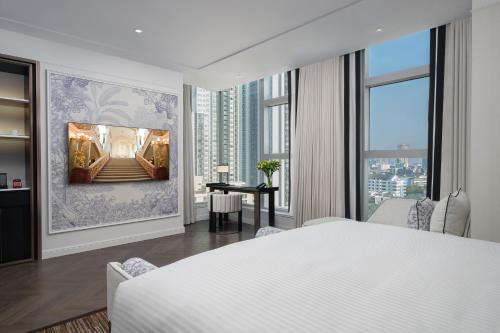 Ένα ή περισσότερα κρεβάτια σε δωμάτιο στο La Clef Bangkok by The Crest Collection