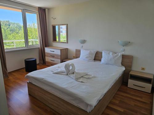 Postel nebo postele na pokoji v ubytování Sineva Apartments