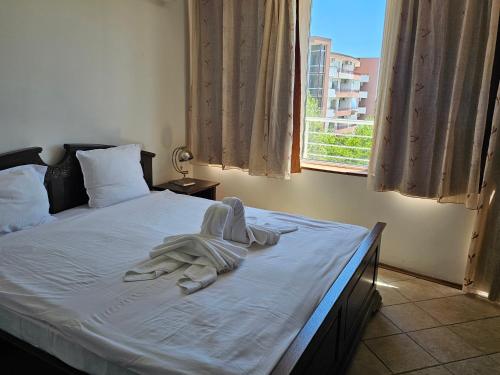 Postel nebo postele na pokoji v ubytování Sineva Apartments