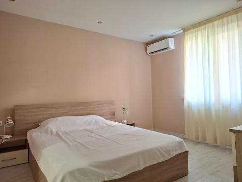 Postel nebo postele na pokoji v ubytování Sineva Apartments