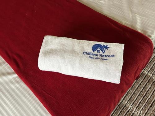 a red blanket with the chicago federation logo on it at Chillaxx Retreat in Yercaud