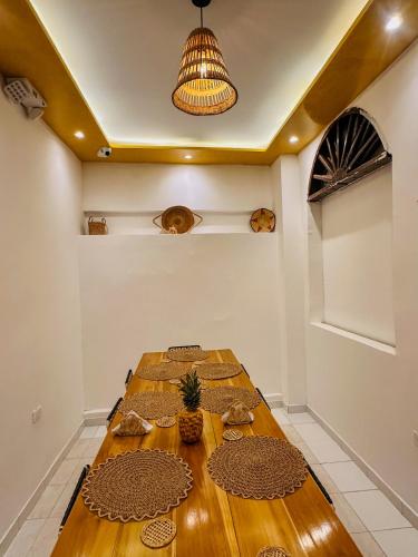 a long table in a room with a ceiling at Hostal Casa Torres Centro Historico - Adults Only in Cartagena de Indias