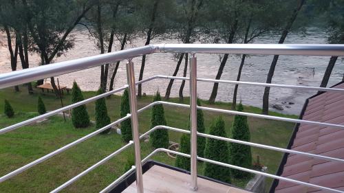 a view of a river from a balcony at Apartmani Kriva Drina in Okletac