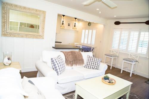 a living room with a white couch and a table at 4980 Sandyland Road #216 in Carpinteria