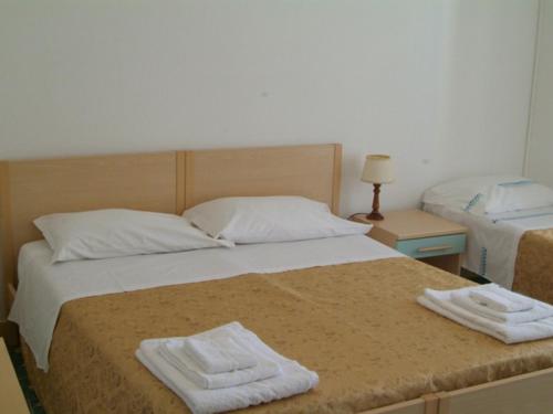 Postel nebo postele na pokoji v ubytování Hotel Aurora