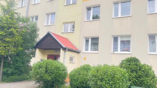 a building with a smallshed on the side of it at Mieszkanie Giżycko in Giżycko
