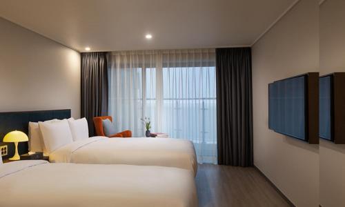 Katil atau katil-katil dalam bilik di Busan Yeongmu Parade Hotel Haeundae Beach